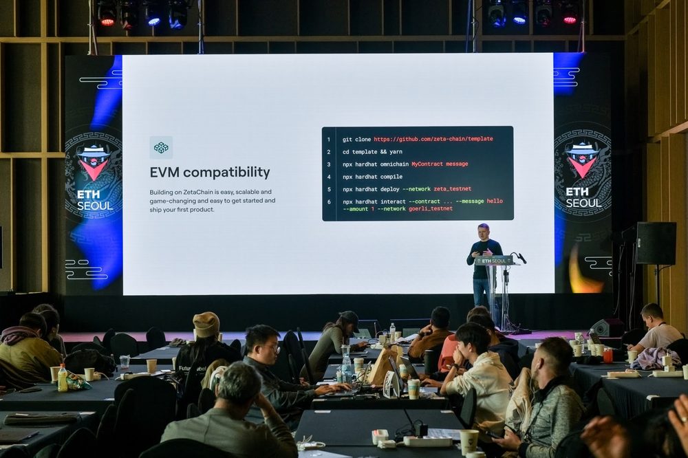 Denis at a lectern next to a slide of ZetaChain template commands